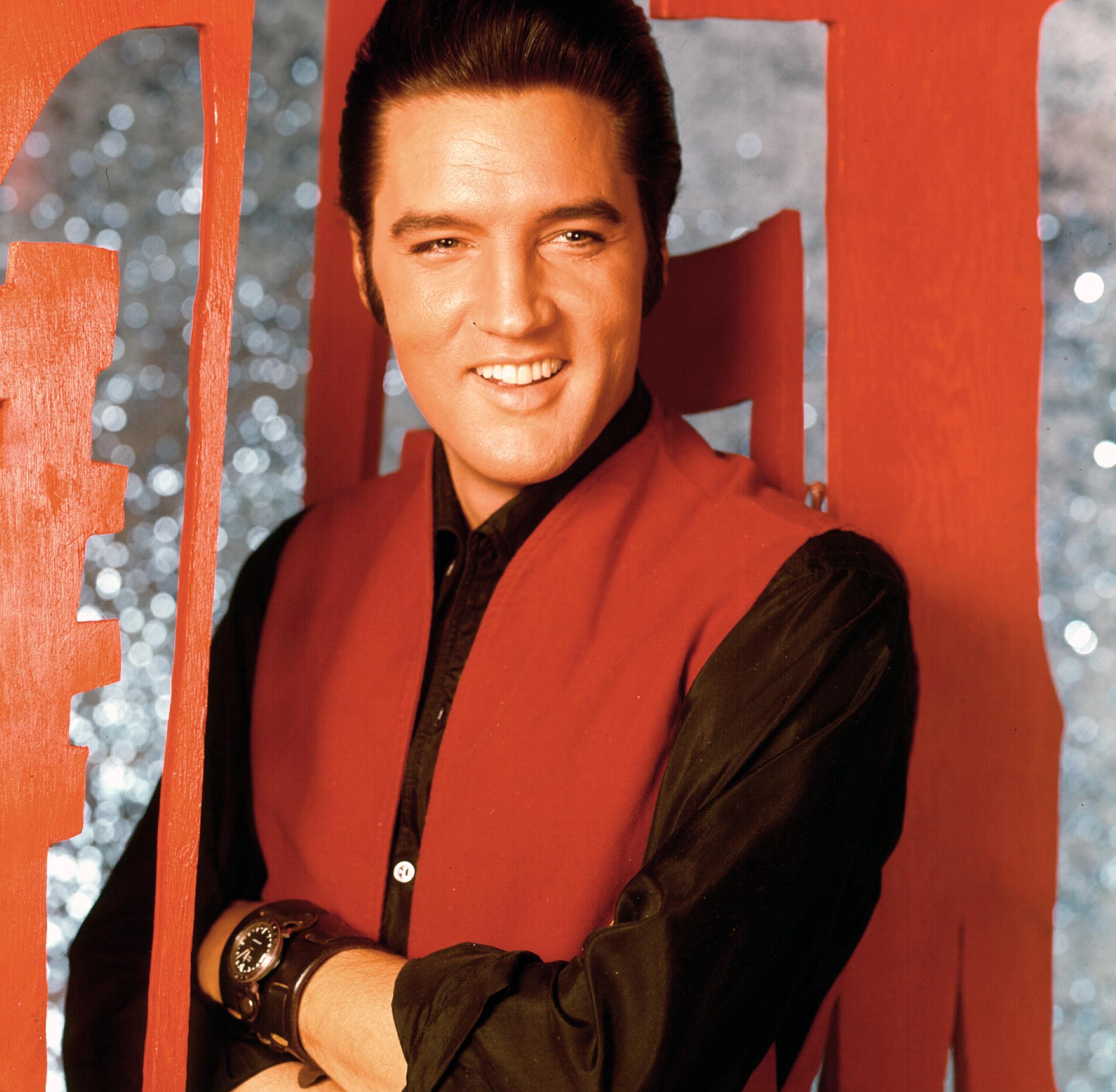 "Can't Help Falling in Love" singer Elvis Presley wearing red