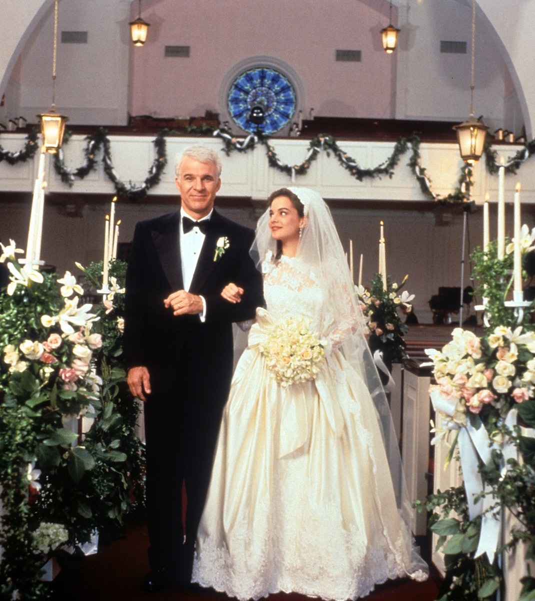 Steve Martin walking down the aisle with Kimberly Williams-Paisley in a scene from the film 'Father Of The Bride',