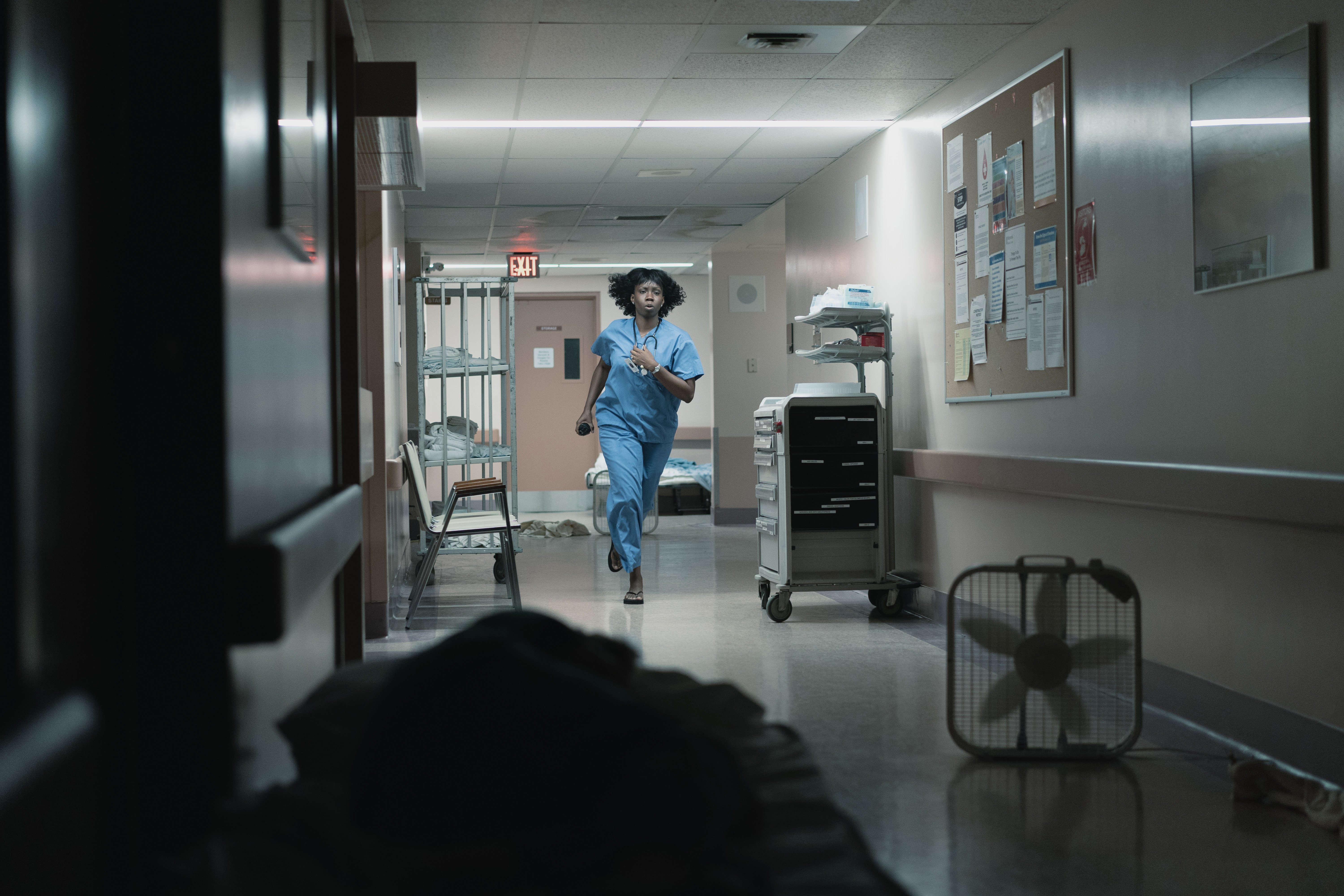 'Five Days At Memorial' on Apple TV+: Adepero Oduye running down the hall as Nurse Karen Wynn
