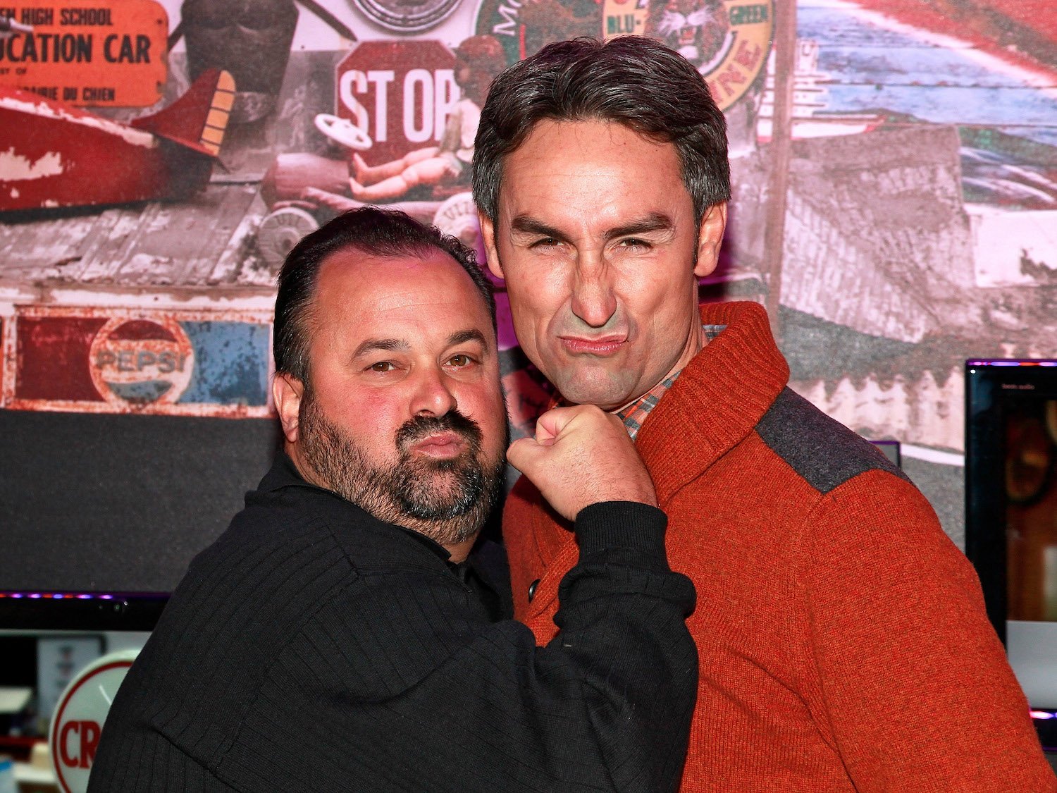 Frank Fritz and Mike Wolfe from 'American Pickers' standing together and making faces at the camera