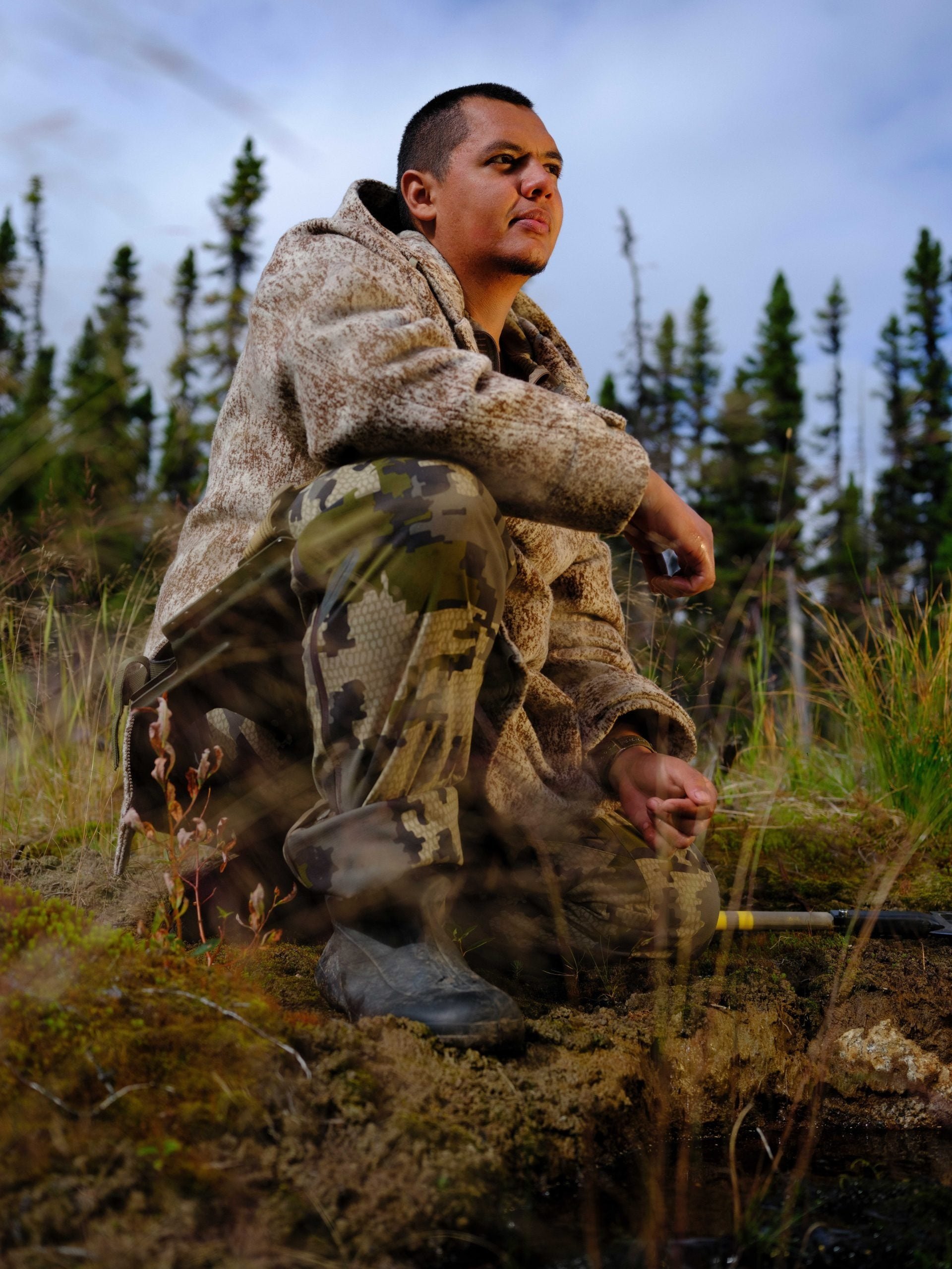 'Alone' Season 9 winner Juan Pablo Quiñonez sitting in the wilderness