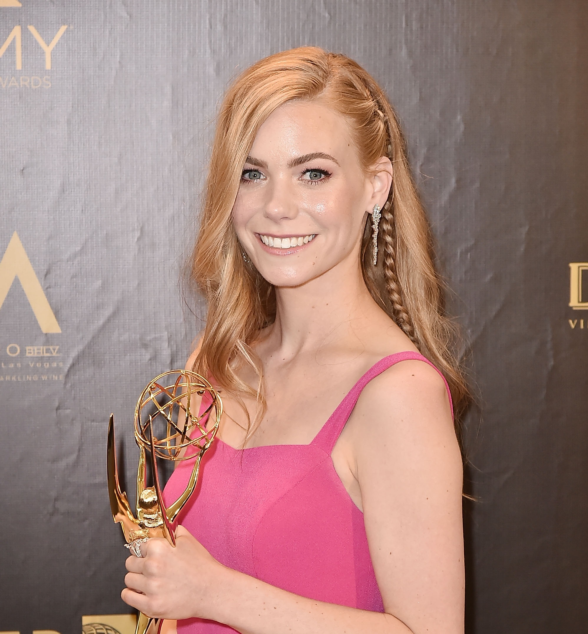 'General Hospital' star Chloe Lanier wearing a pink dress and holding her Daytime Emmy award.