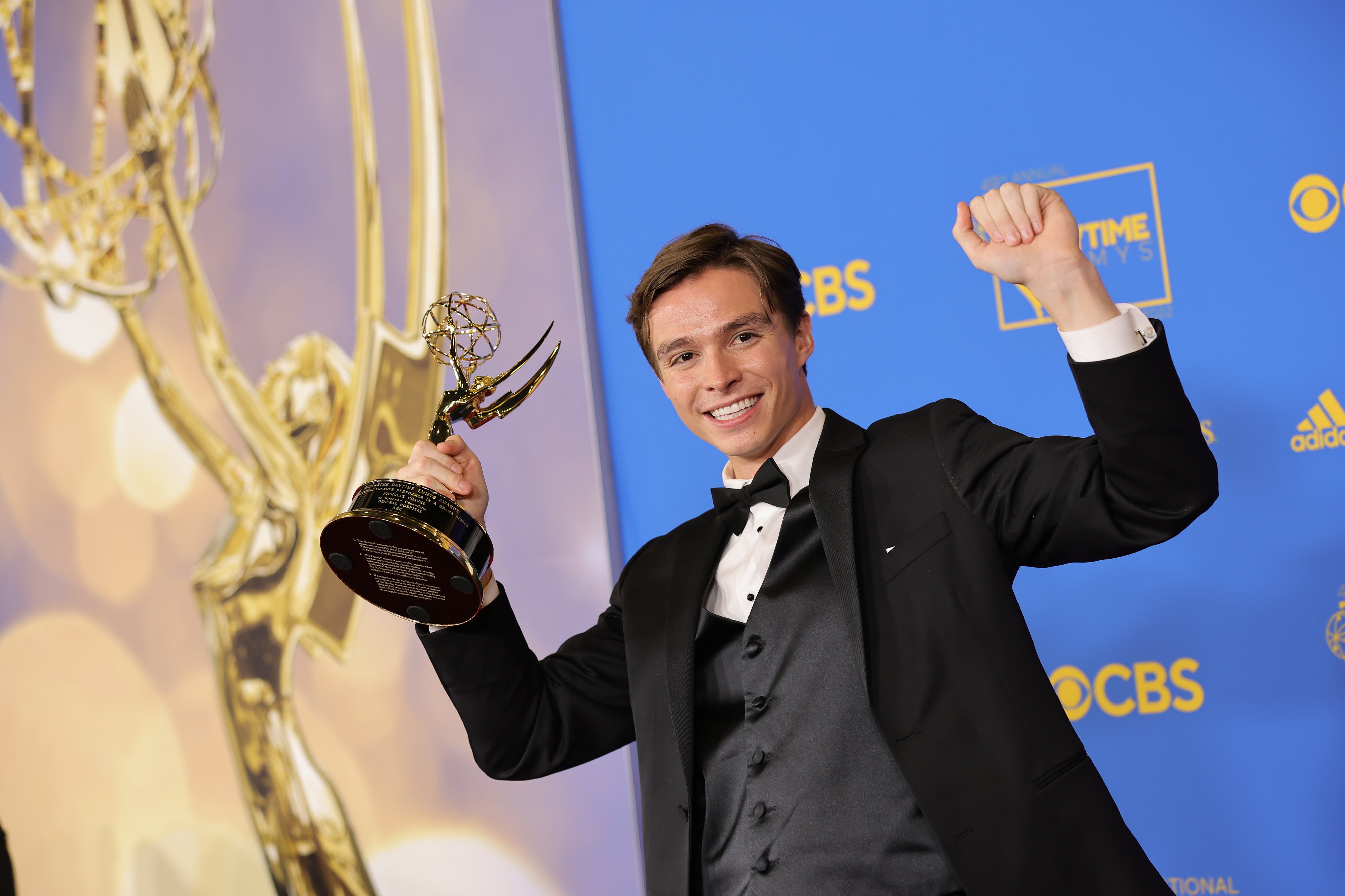 'General Hospital' star Nicholas Chavez wearing a tuxedo and holding a Daytime Emmy.