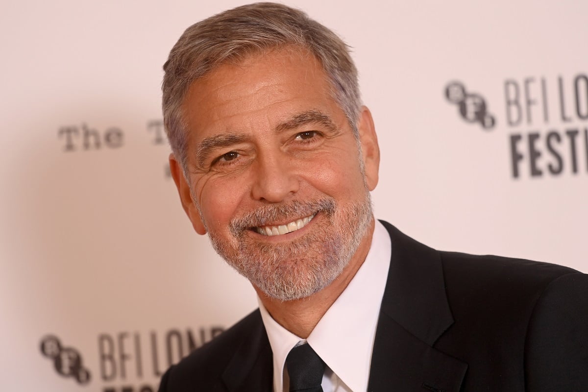 George Clooney smiling while wearing a suit.