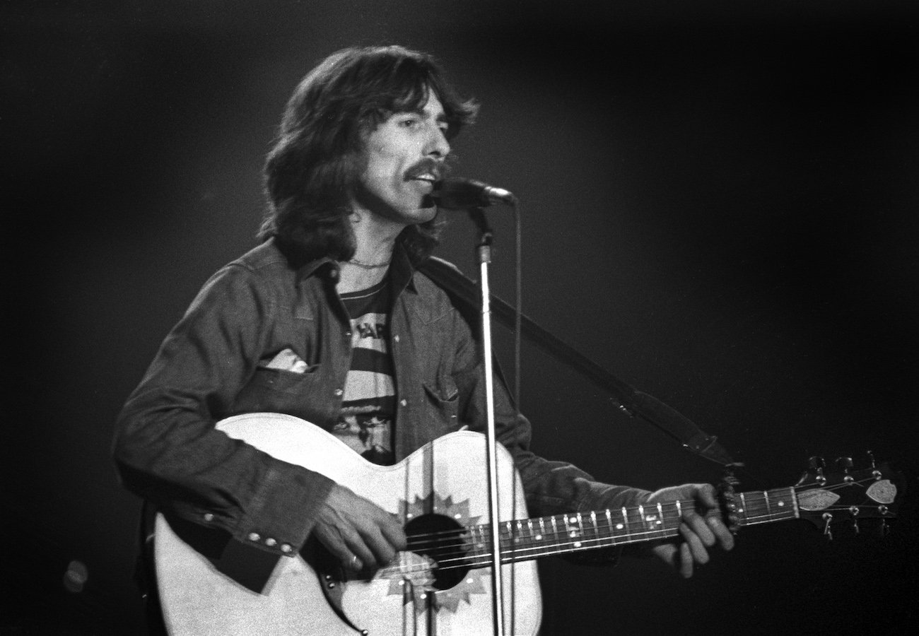 George Harrison performing in Detroit in 1974.