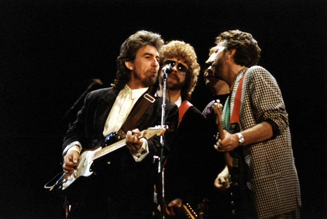 George Harrison, Jeff Lynne, and Eric Clapton singing at the Prince's Trust Concert in 1987.