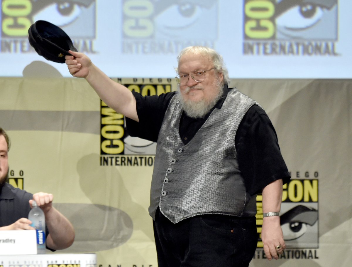 George R.R. Martin tips his cap as he attends HBO's 