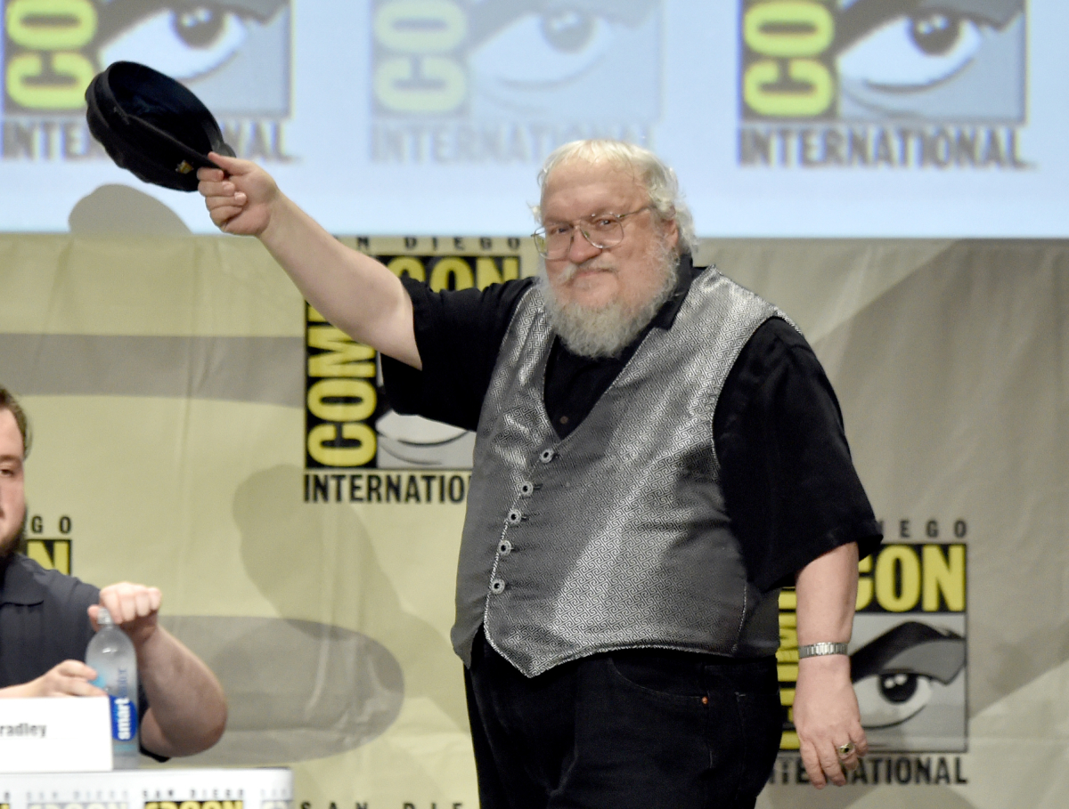 George R.R. Martin tips his cap as he attends HBO's "Game Of Thrones" panel and Q&A during Comic-Con International 2014 at San Diego Convention Center on July 25, 2014 in San Diego, California