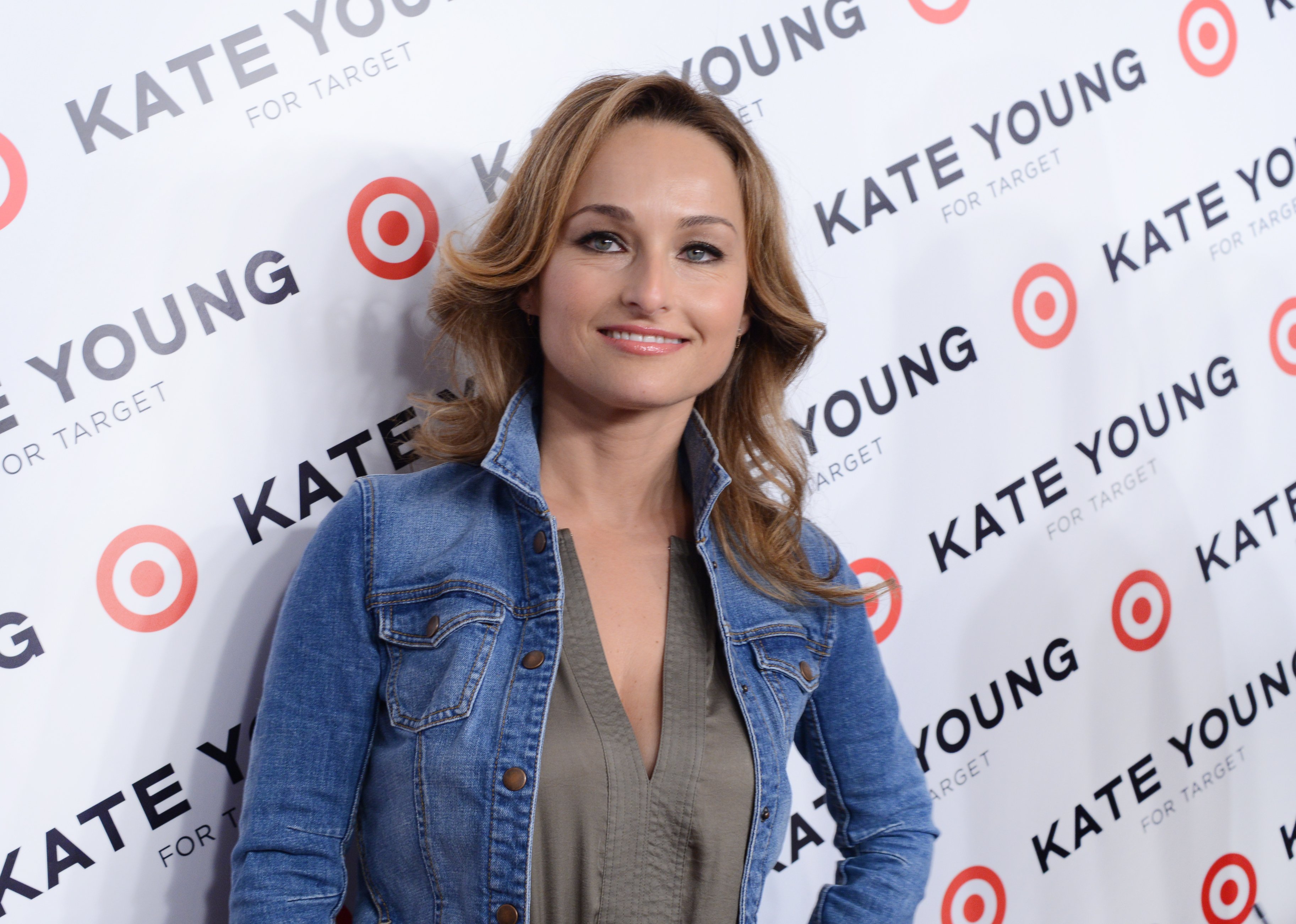 Celebrity chef Giada De Laurentiis wears a denim jacket and gray blouse in this photograph.