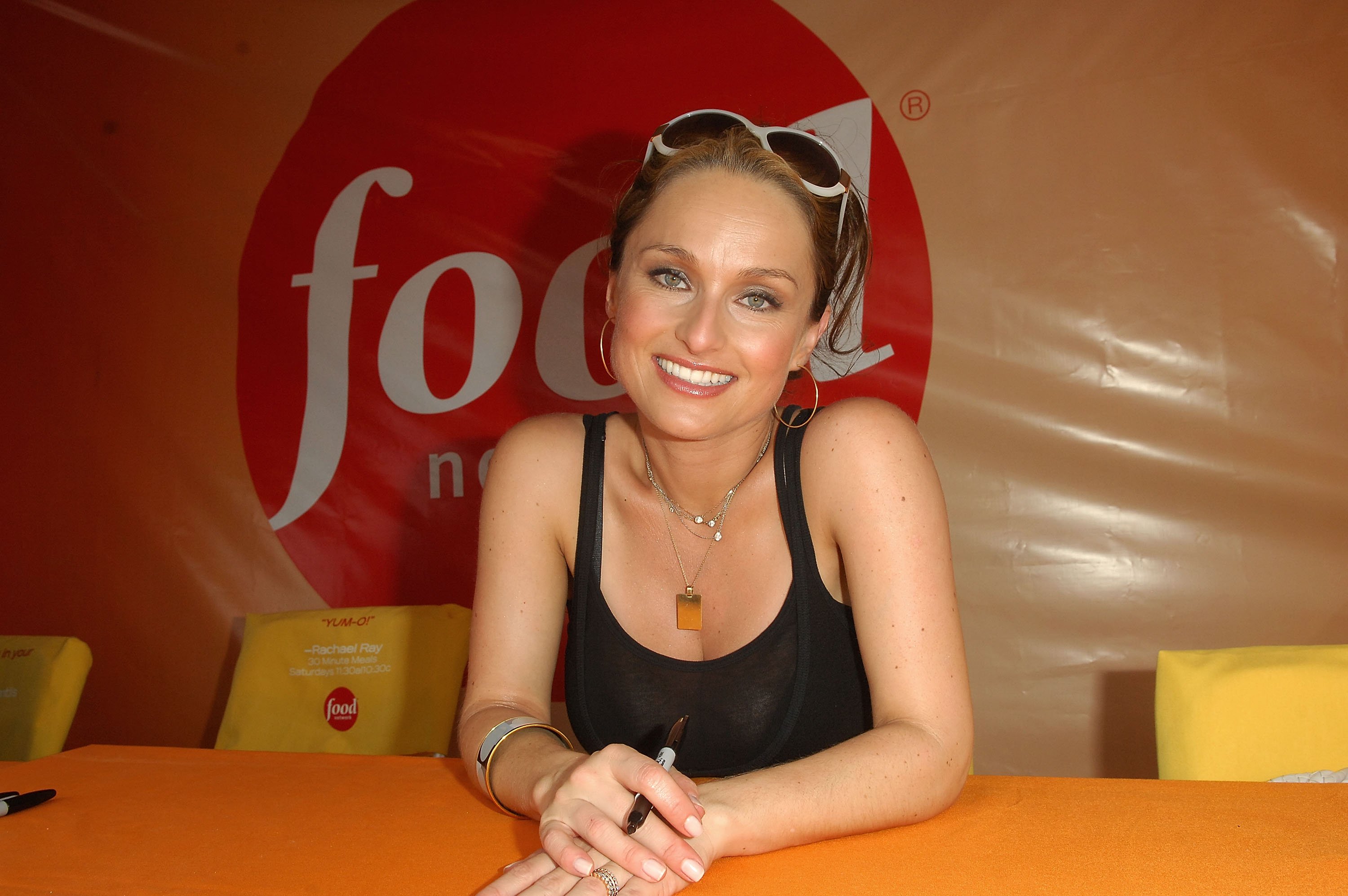 Culinary star Giada De Laurentiis wears a black tank top in this photograph.