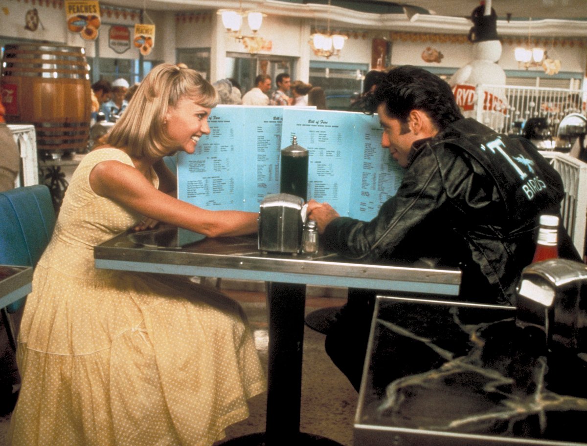 Olivia Newton-John and John Travolta film a diner scene for Grease in 1978