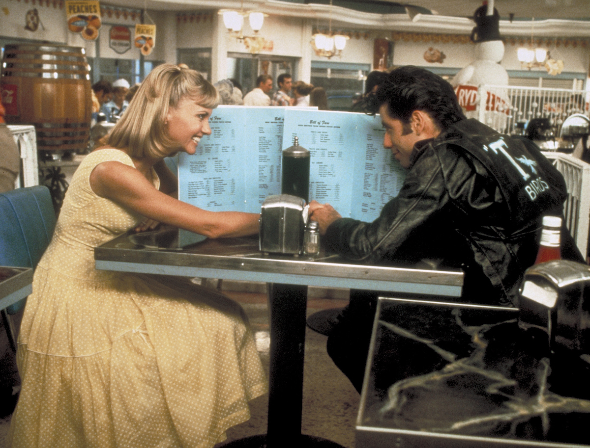 Olivia Newton-John and John Travolta film a diner scene for Grease in 1978