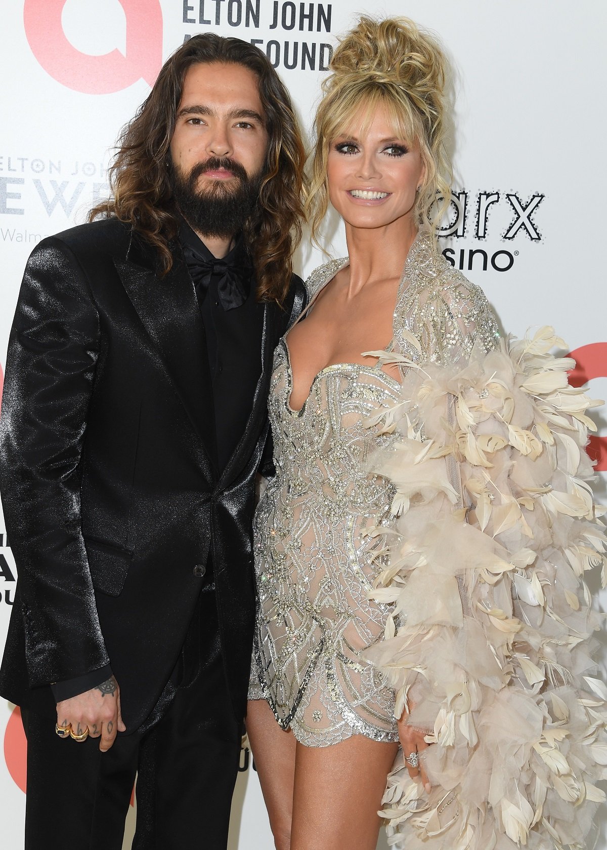 Heidi Klum and Tom Kaulitz pose together on the red carpet at the Elton John AIDS Foundation's Annual Academy Awards Viewing Party
