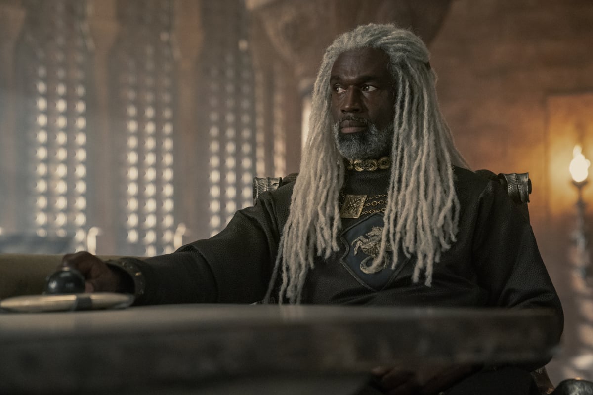 Steve Toussaint as Corlys Velaryon in House of the Dragon sitting at a table. 