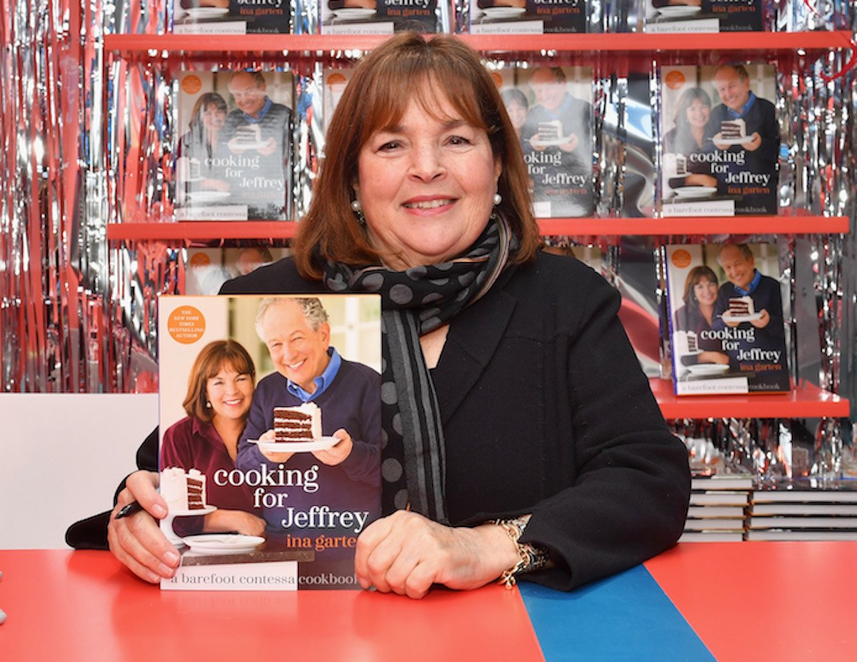 Ina Garten, who has a corn pancake recipe, smiles holding a copy of 'Cooking for Jeffrey'