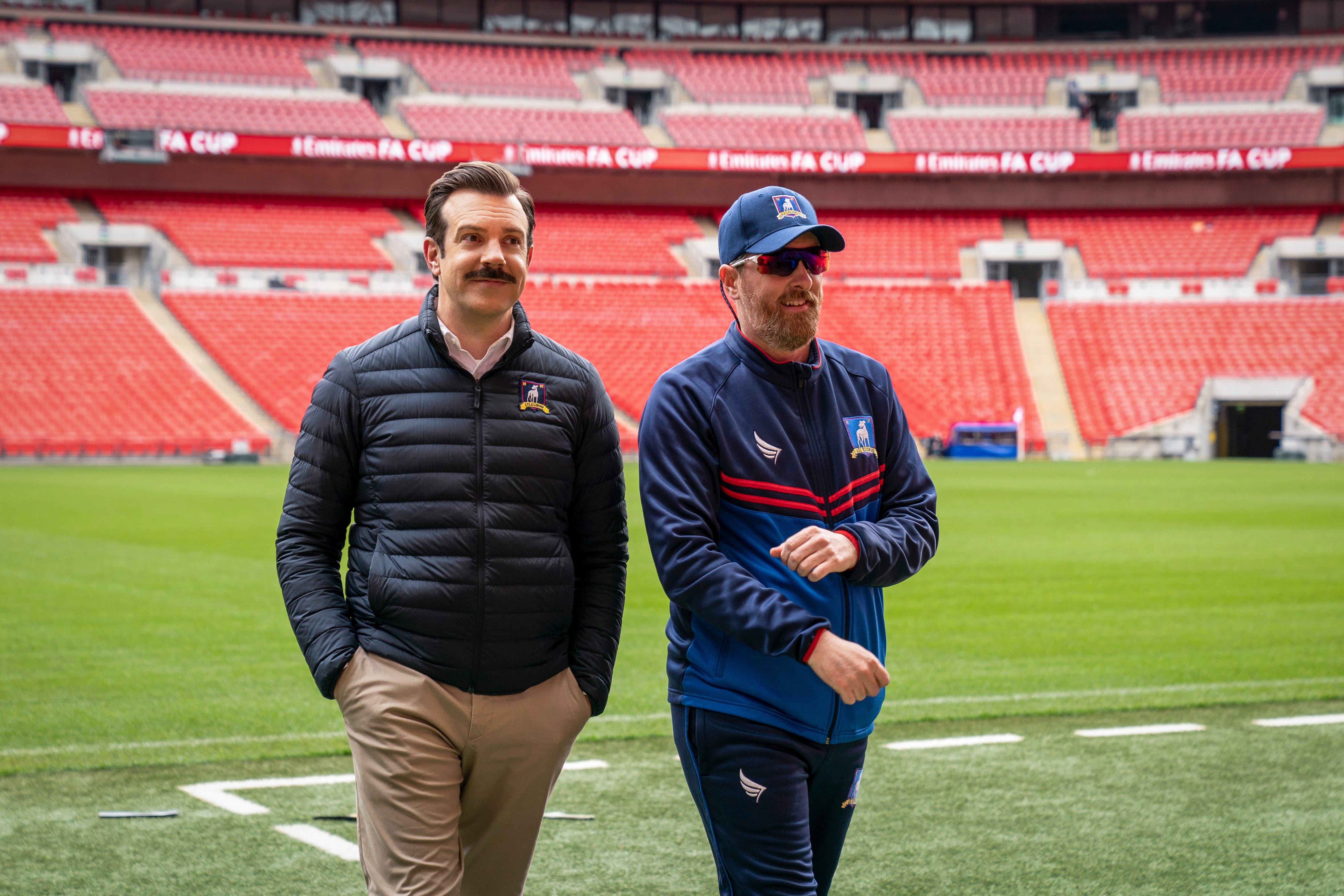 Jason Sudeikis as Ted Lasso and Brendan Hunt as Coach Beard in Ted Lasso