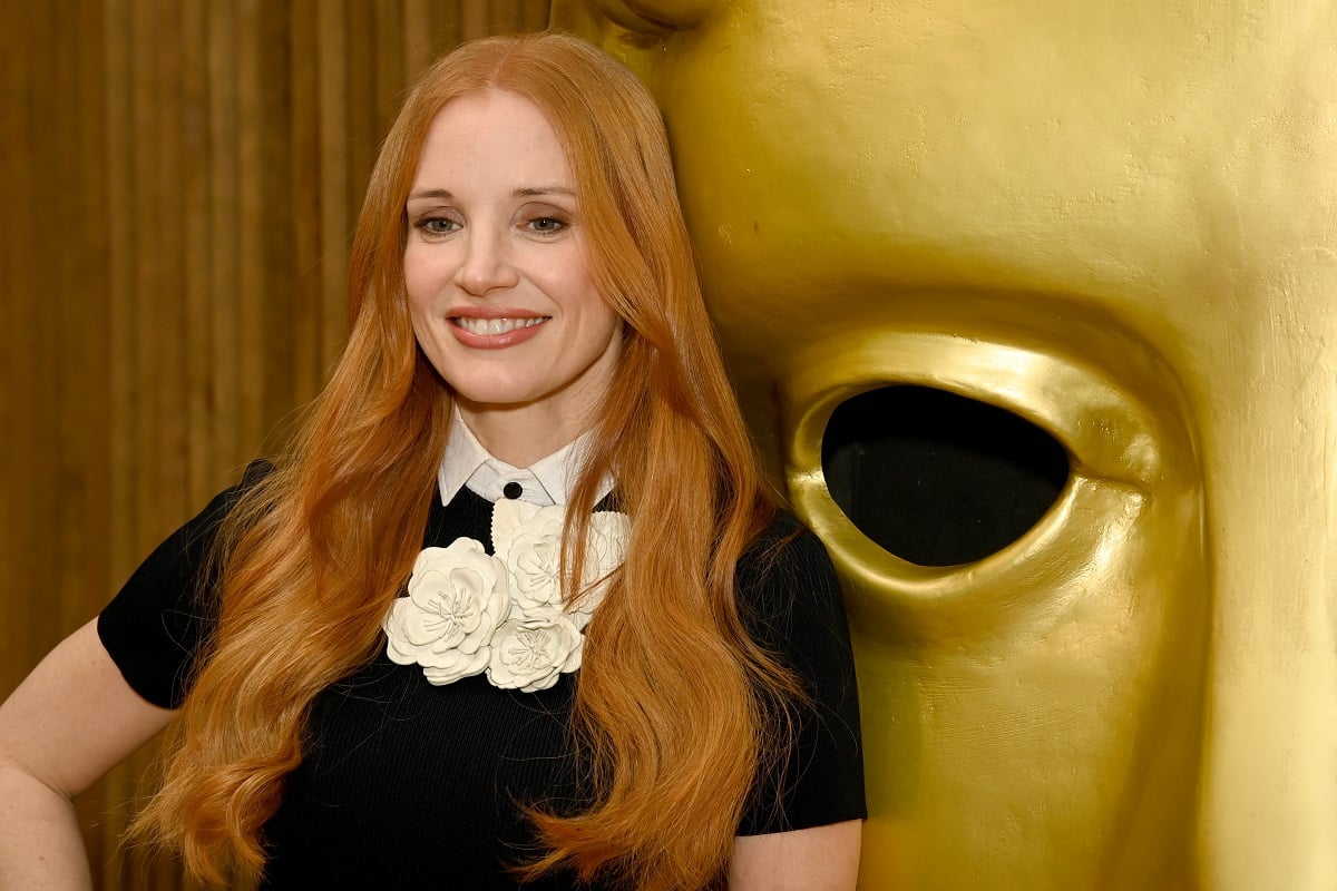 Jessica Chastain smiling while wearing a black dress.