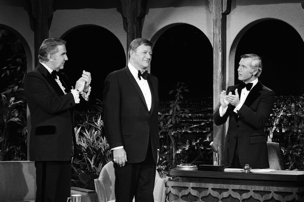 John Wayne (center) visits 'The Tonight Show' with Johnny Carson (R) and Ed McMcMahon (L) in 1972
