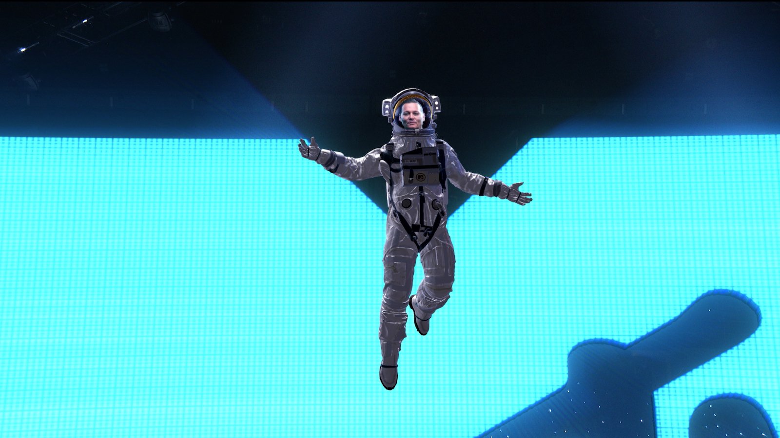 Johnny Depp is suspended above the audience wearing a spacesuit at the 2022 MTV VMAs. 