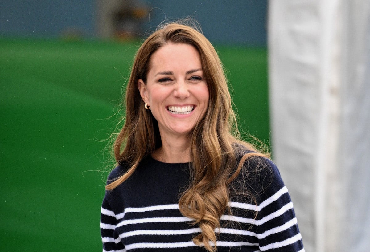 Kate Middleton, who has a photo hack for looking 'stunning' in photos according to a stylist's TikTok, smiles wearing a striped shirt