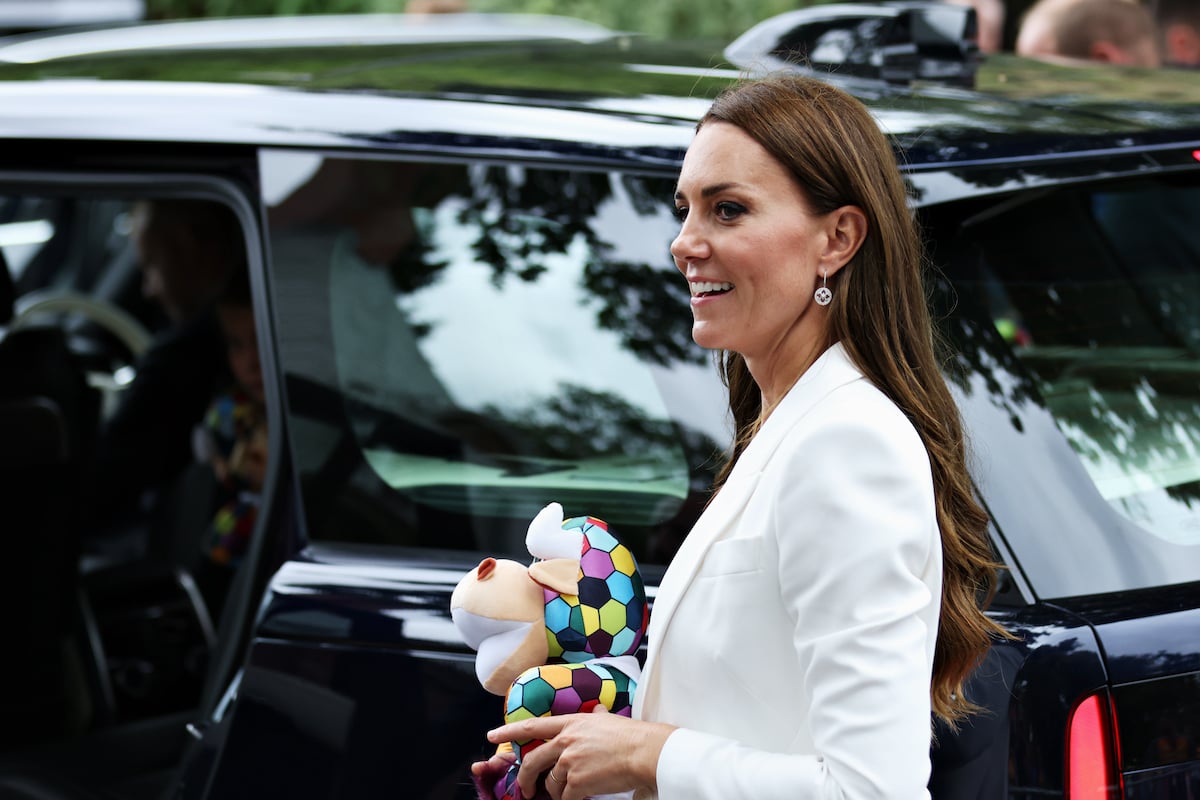 Kate Middleton, who has a photo hack according to a viral TikTok video, wears a white blazer