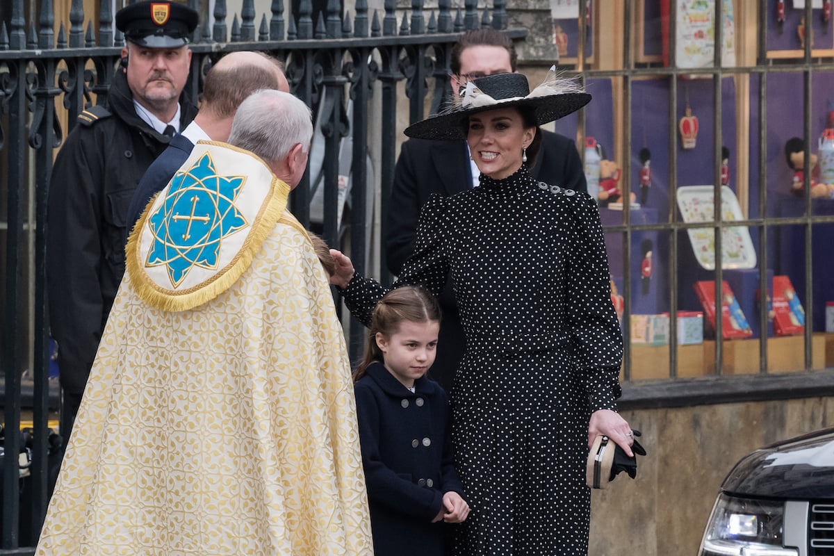 Kate Middleton, who received praise for shushing Princess Charlotte, stands with Princess Charlotte at Prince Philip's memorial