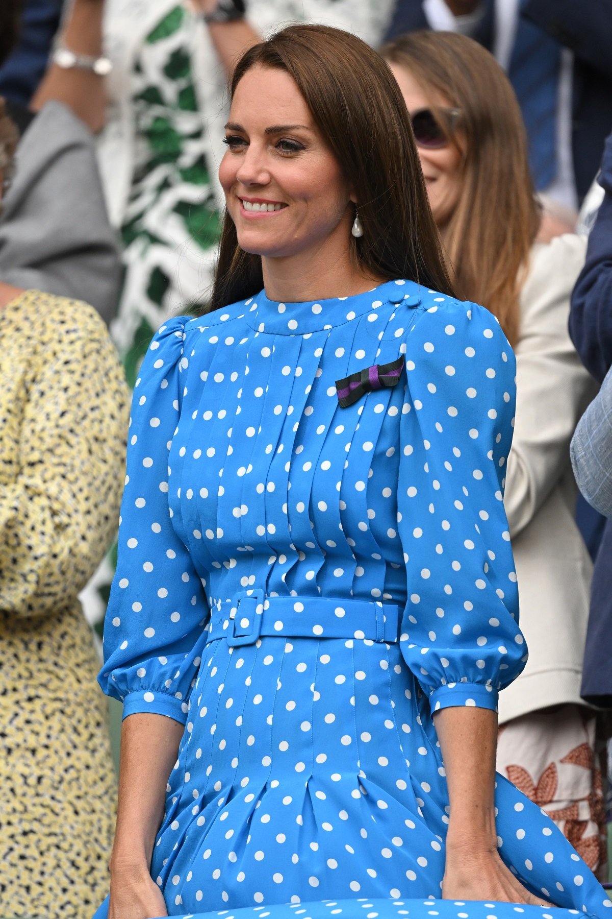 Kate Middleton smiling at All England Lawn Tennis and Croquet Club in a light blue polka dot dress
