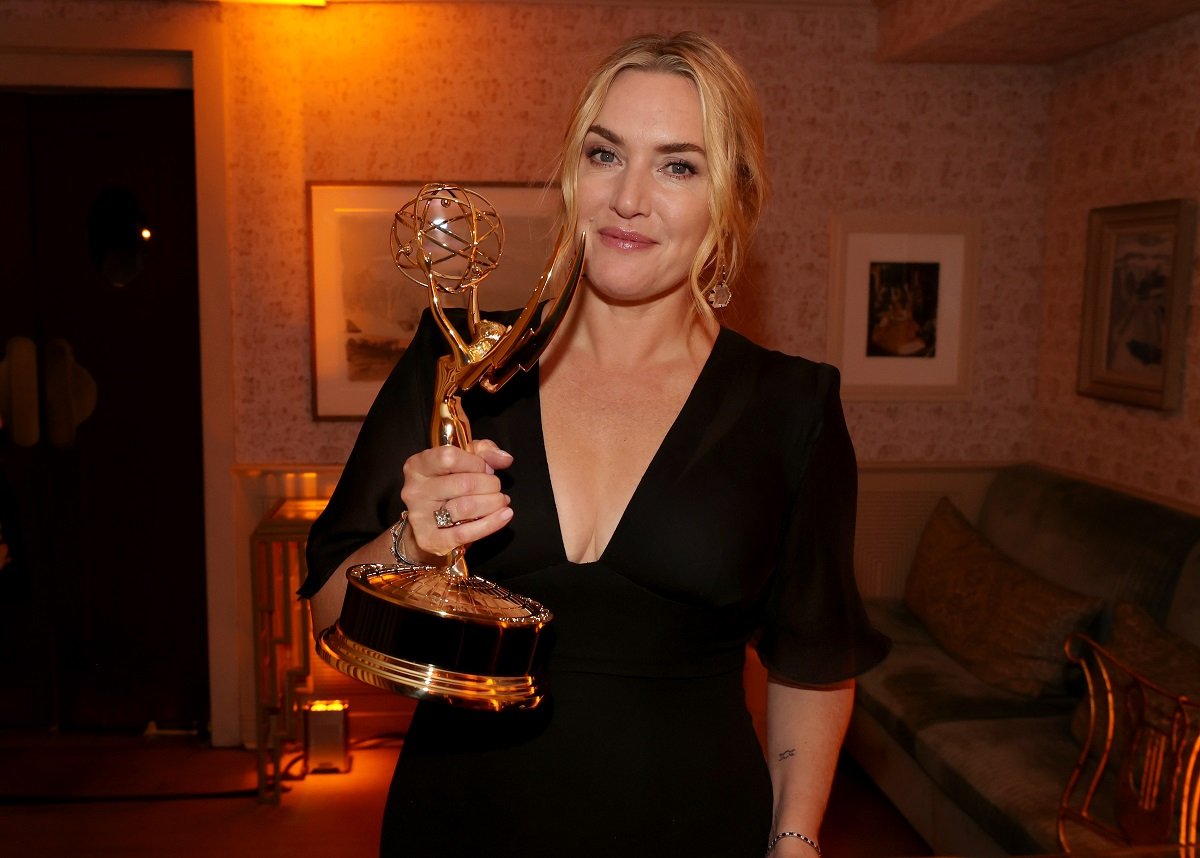 Kate Winslet, who owns a home far away from Hollywood, holds her Emmy during a reception at San Vicente Bungalows