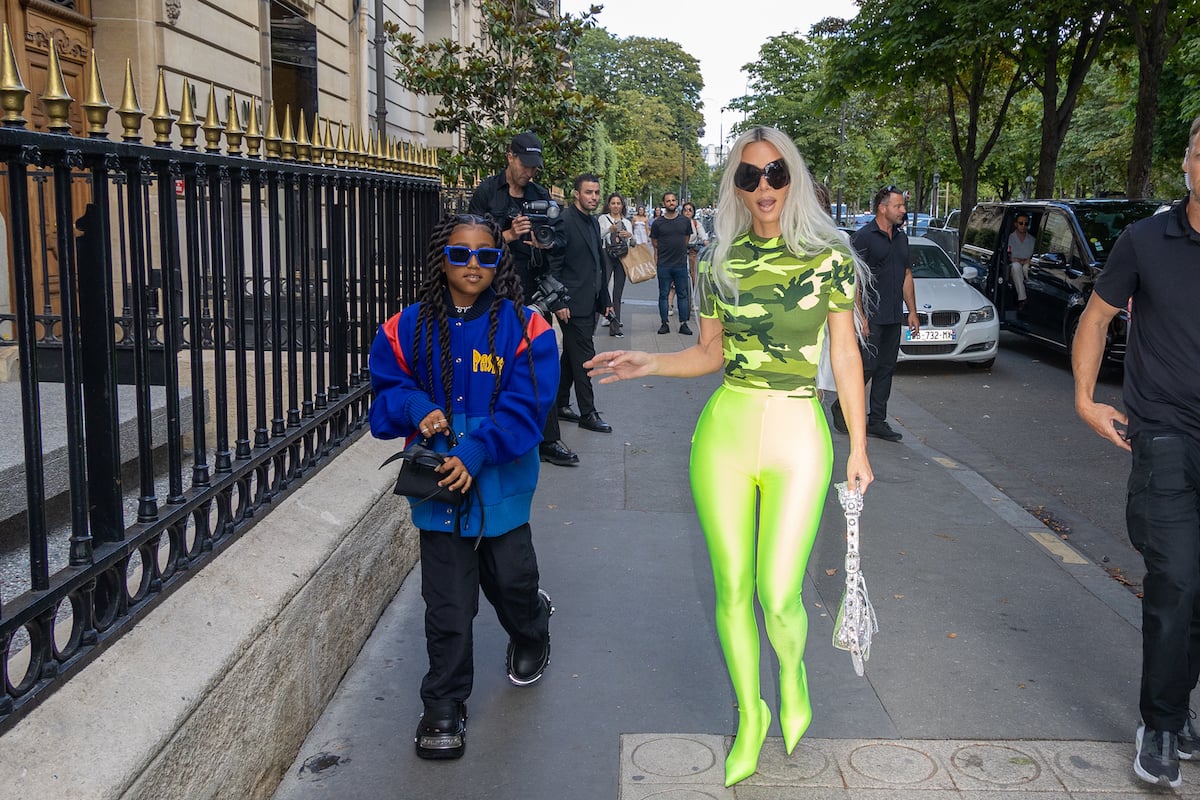 Kim Kardashian (R) and North West (L) walking down a street in Paris, France