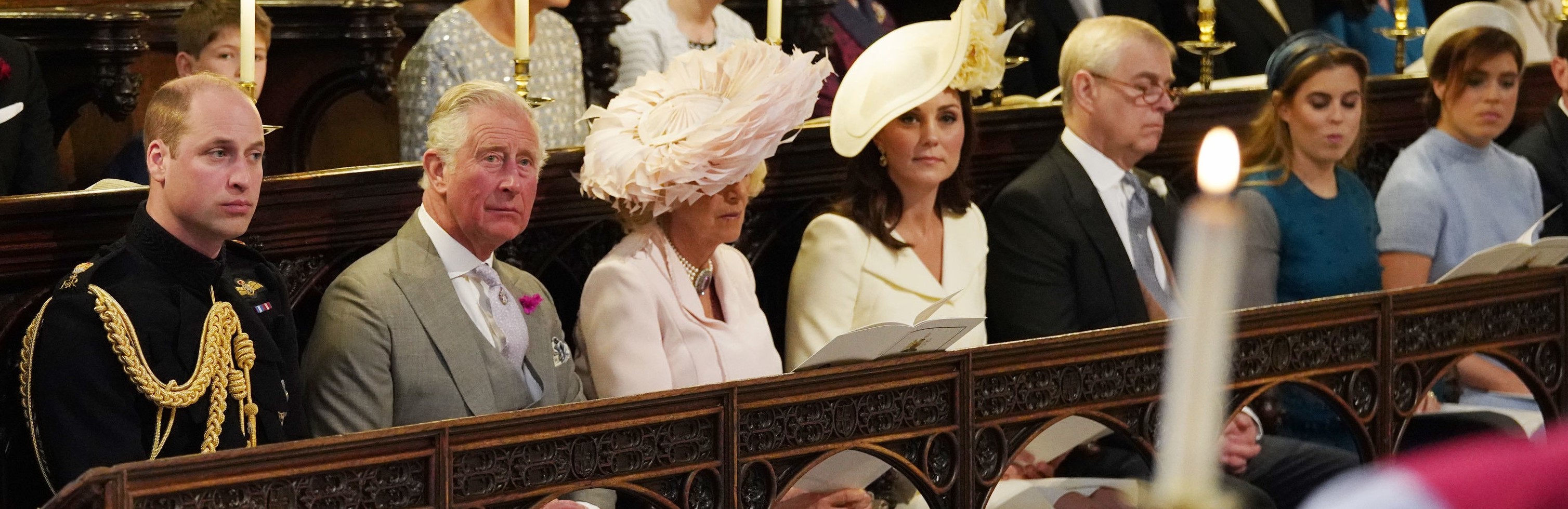 (L-R) Prince William, Prince Charles, Camilla Parker Bowles, Kate Middleton, Prince Andrew, Princess Beatrice, and Princess Eugenie at Prince Harry and Meghan Markle's wedding