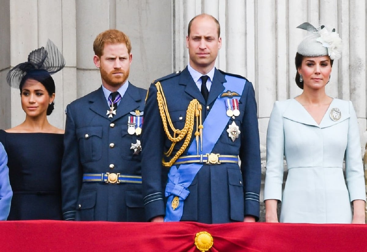 Meghan Markle and Prince Harry, who one expert says needs to grow up, standing on the balcony of Buckingham Palace with Prince William and Kate Middleton