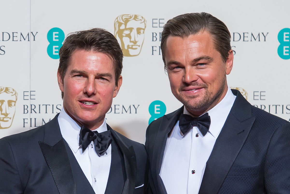 Leonardo DiCaprio and Tom Cruise, who both have a high net worth, pose together at a London event in 2016