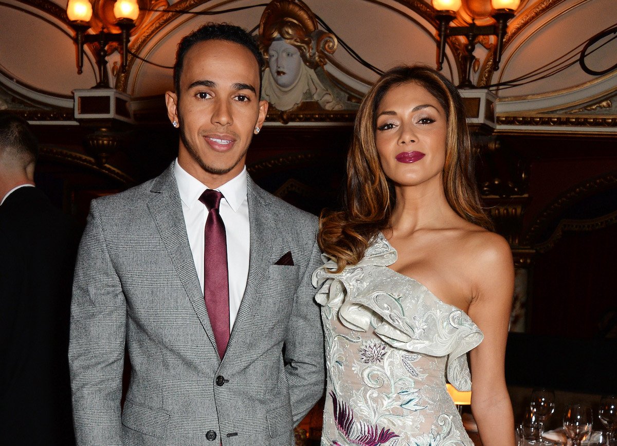 Lewis Hamilton and Nicole Scherzinger attend a reception at the British Fashion Awards in 2014