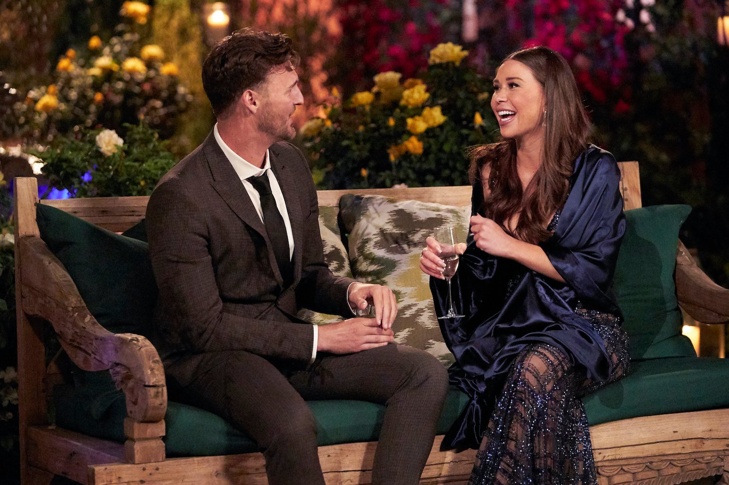 Gabby Windey and Logan Palmer sitting and talking in 'The Bachelorette' Season 19