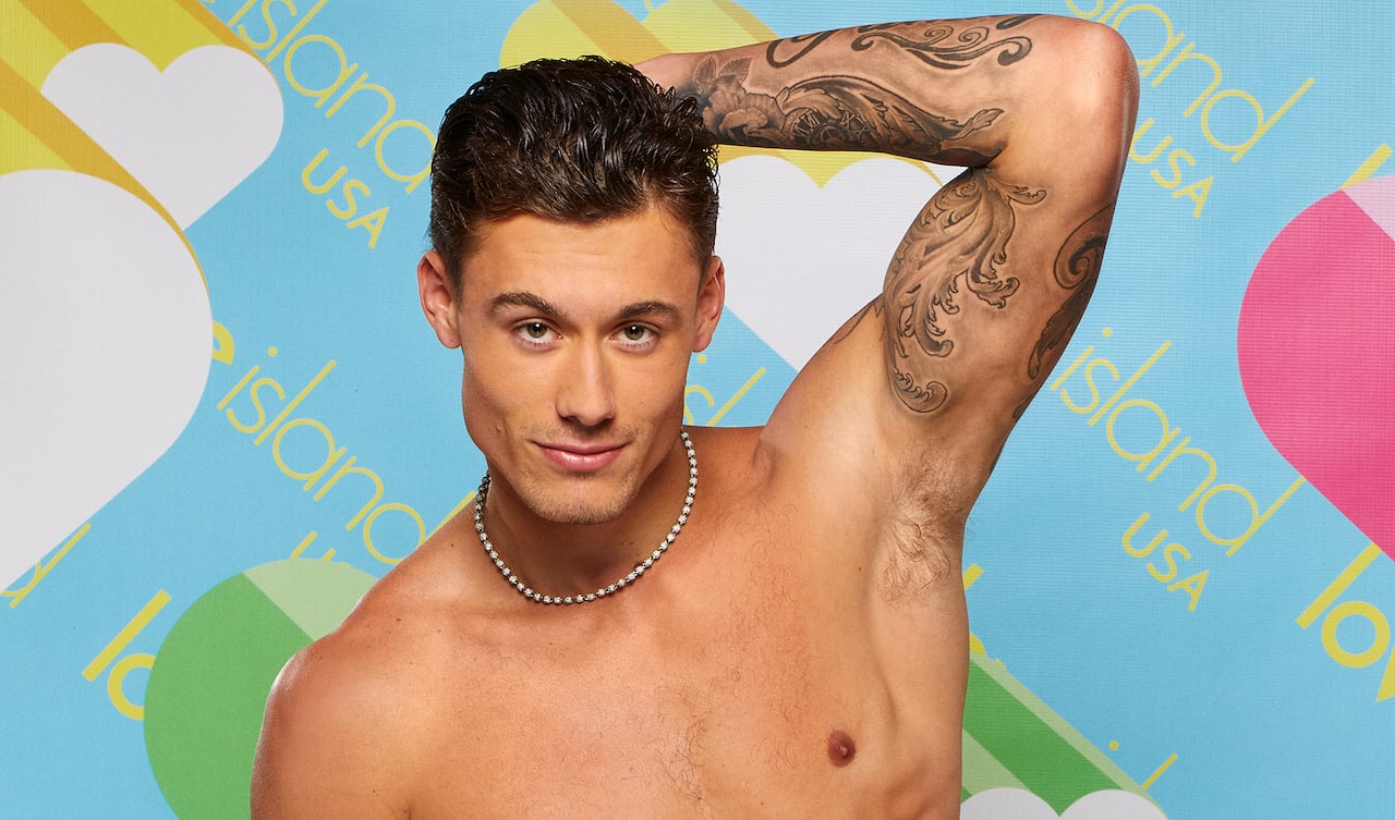 Isaiah Campbell of 'Love Island USA' poses shirtless with his hand behind his head.