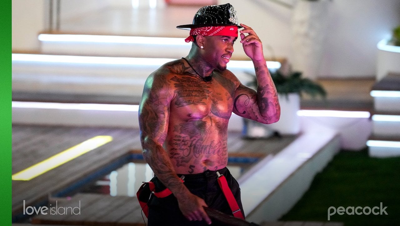 Jeff Christian Jr. is dressed as a shirtless fireman on 'Love Island USA'.