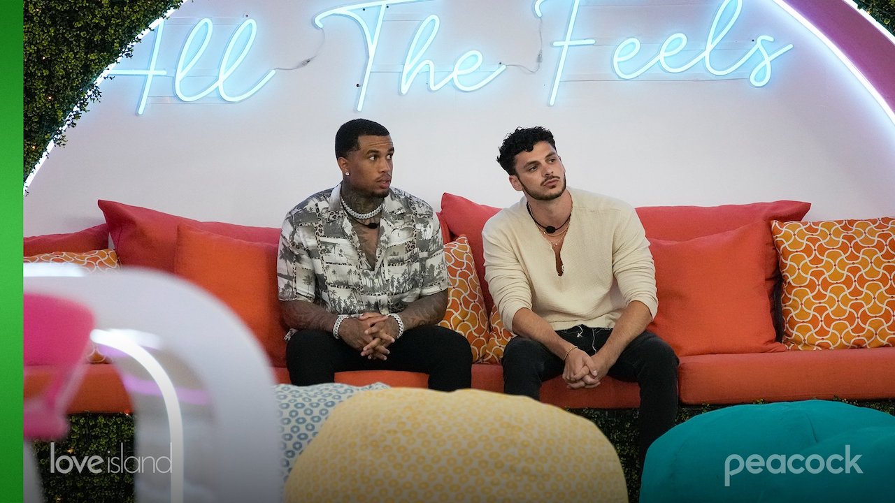 Jeff Christian Jr. and Bryce Fins sit on a couch together on 'Love Island USA'.