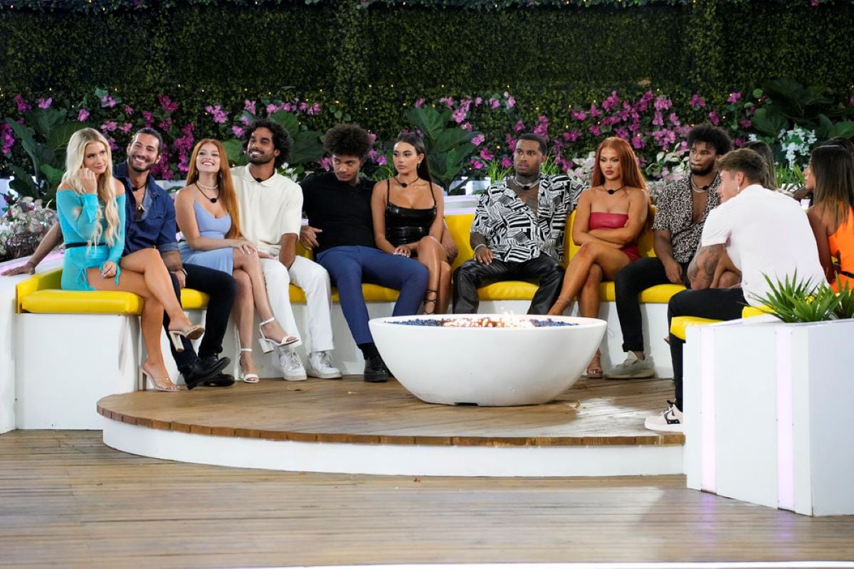 The 'Love Island USA' Season 4 cast, including Deb Chubb, Kyle Fraser, Chanse Corbi, Jared Hassim, Chad Robinson, Courtney Boerner, Jeff Christian Jr., Sydney Paight, Chazz Bryant, Isaiah Campbell, and Phoebe Siegel
