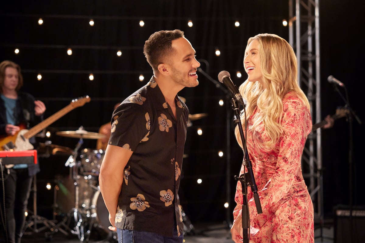 Carlos and Alexa PenaVega singing into a microphone in the Hallmark Channel movie 'Love in the Limelight'