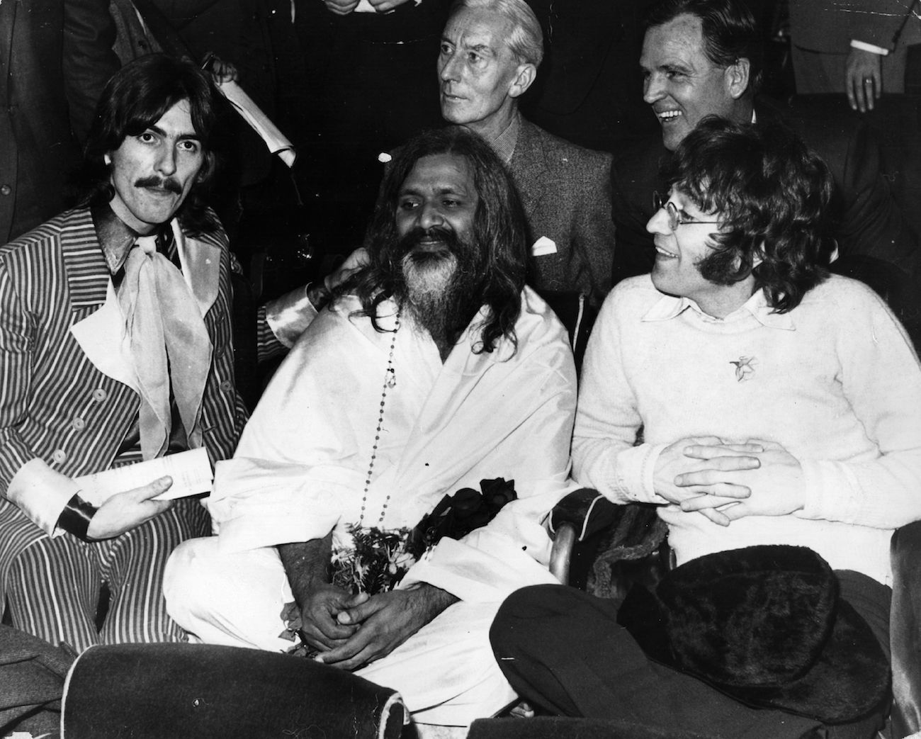 George Harrison, Maharishi Mahesh Yogi, and John Lennon at the UNICEF Gala in Paris in 1967.