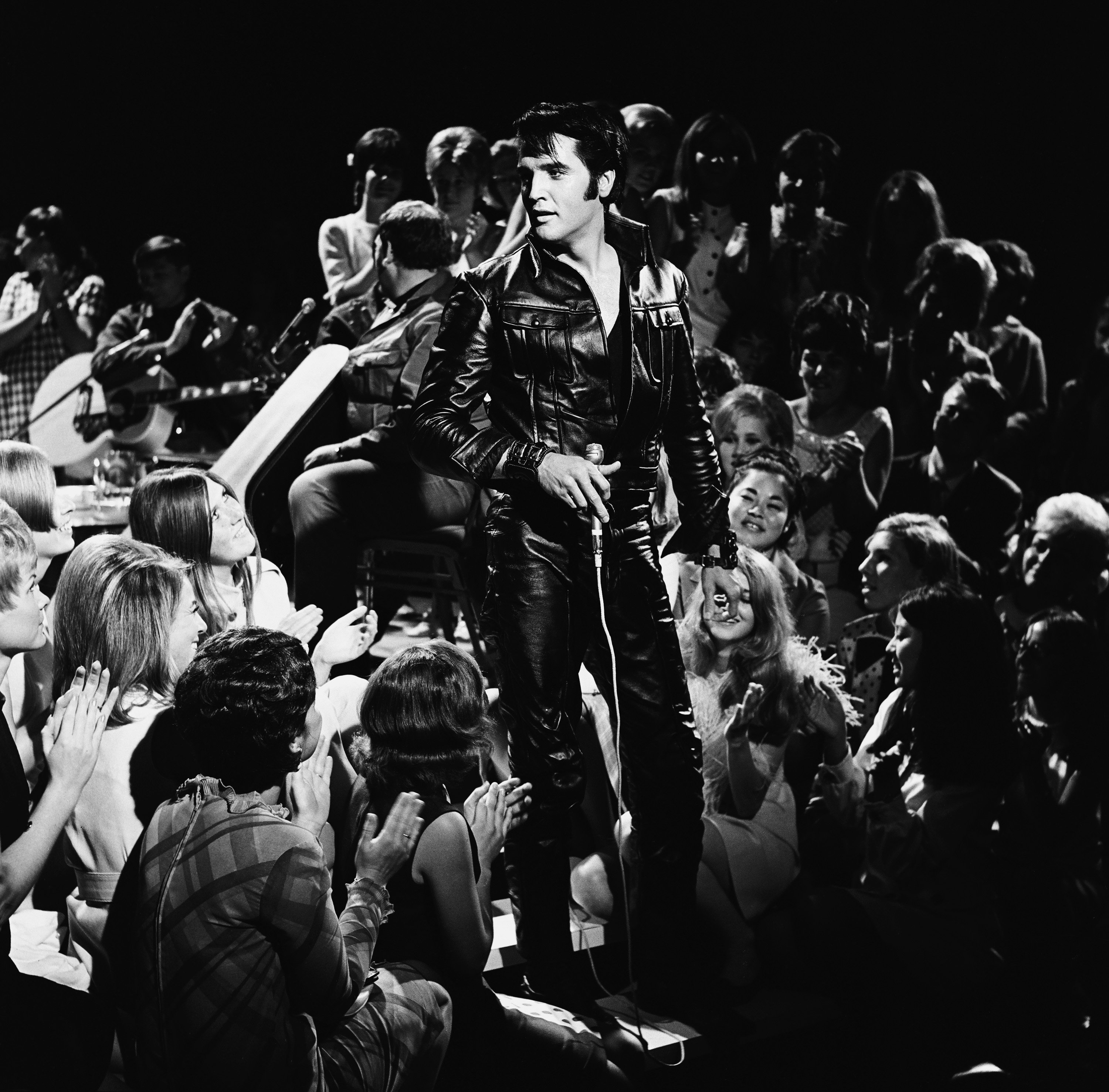 Elvis Presley surrounded by fans during the "If I Can Dream"era
