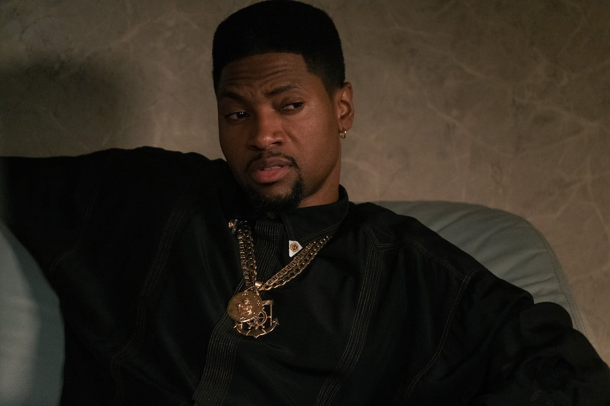 London Brown as Marvin wearing a black sweater and gold chain in 'Power Book III: Raising Kanan'