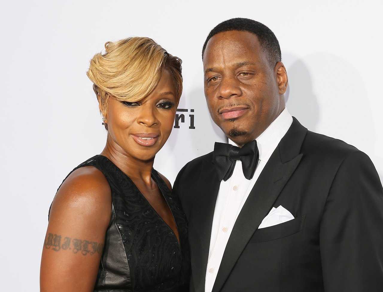 Mary J. Blige and Kendu Isaacs pose on red carpet; Blige won't perform "Be Without You" because the song is about Isaacs