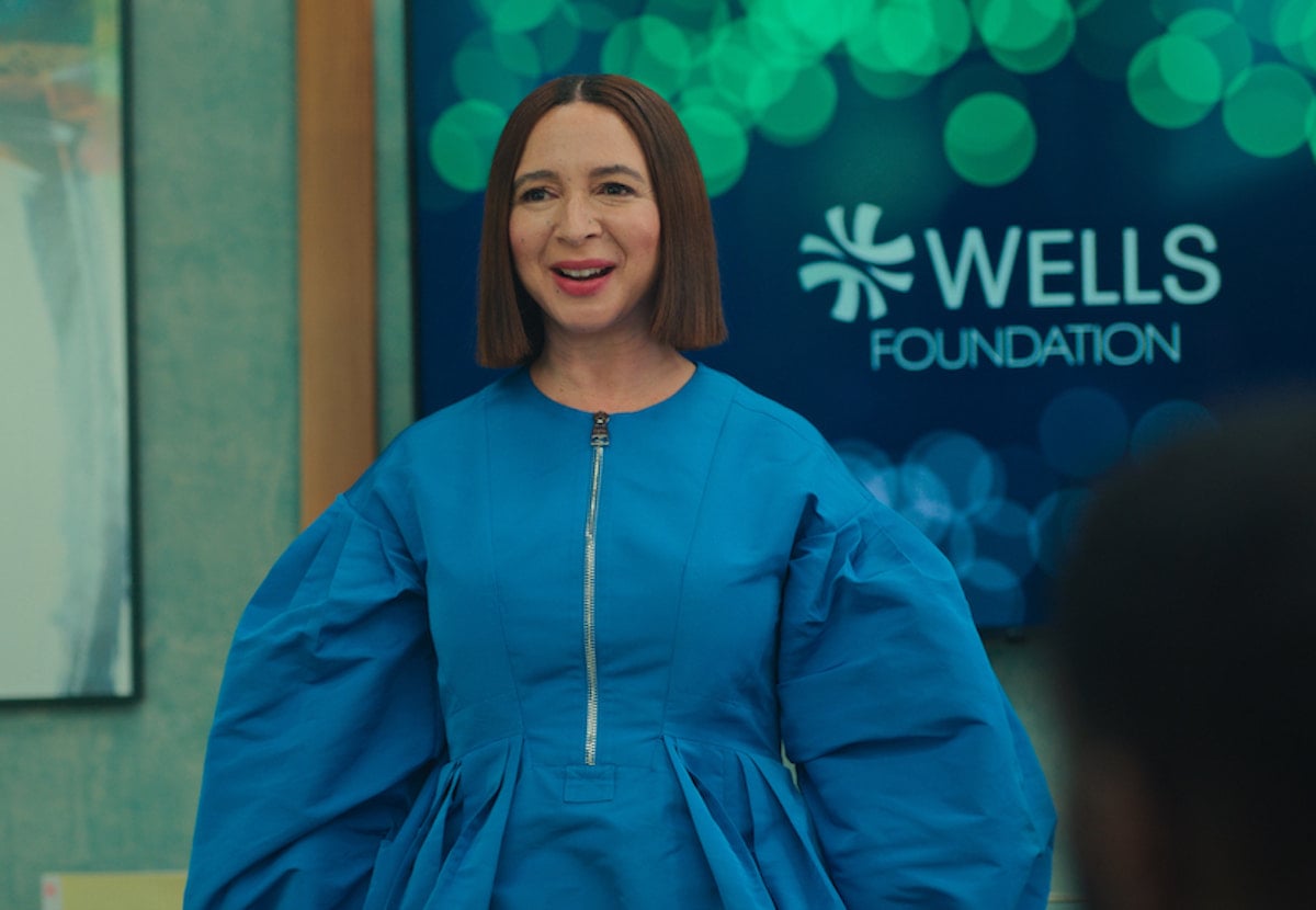 Maya Rudolph wears a blue dress in a scene from 'Loot' Season 1 Episode 9: 'Cahoga Lake'