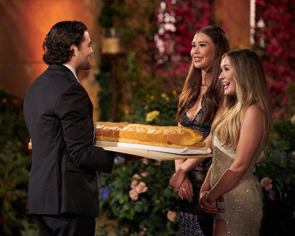 Rachel Recchia and Gabby Windey meeting James 'Meatball' Clarke on night one of 'The Bachelorette' 2022. He brings them a large meatball sub.