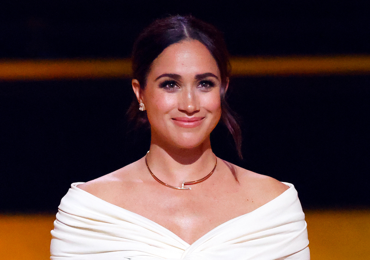Meghan Markle, who had stand-out moments on the 'Archetypes' podcast premiere, smiles and looks on