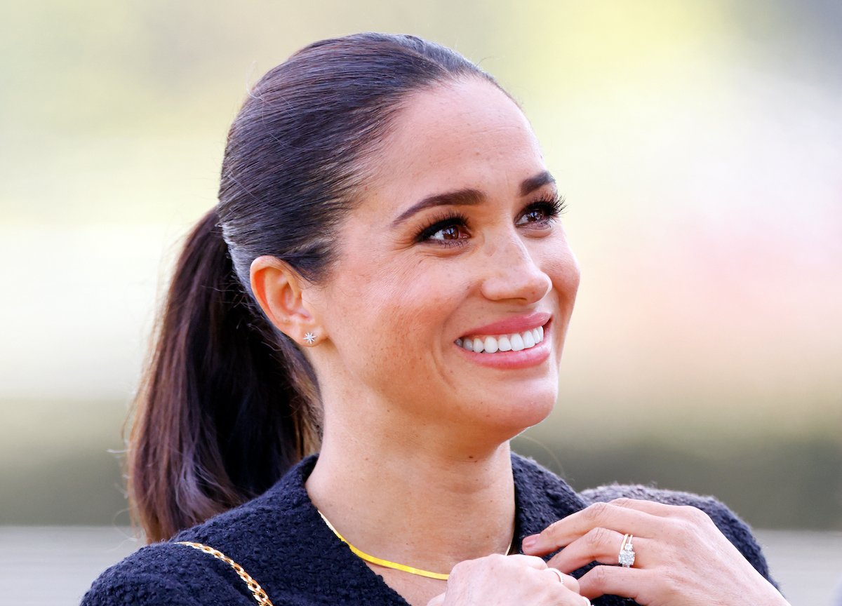 Meghan Markle, who asked for a birthday gift from The Tig readers in 2014, smiles and looks on