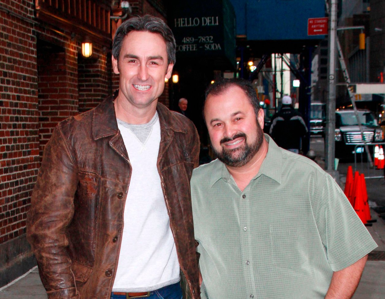 Mike Wolfe and Frank Fritz, the stars of 'American Pickers,' standing next to each other and smiling
