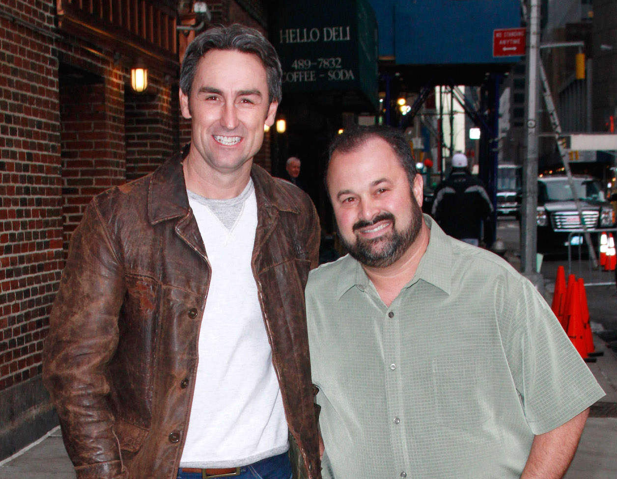Mike Wolfe and Frank Fritz, the stars of 'American Pickers,' standing next to each other and smiling