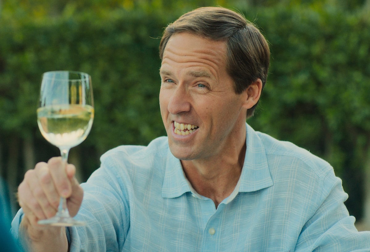 Nat Faxon raises a glass as Arthur in 'Loot' Season 1 Episode 10: 'The Silver Moon Summit'